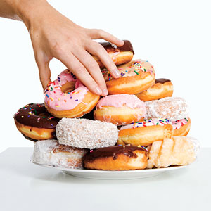 Adding insult to injury by consuming sugary snacks while enduring long, metabolism-slowing sitting sessions around a conference table
