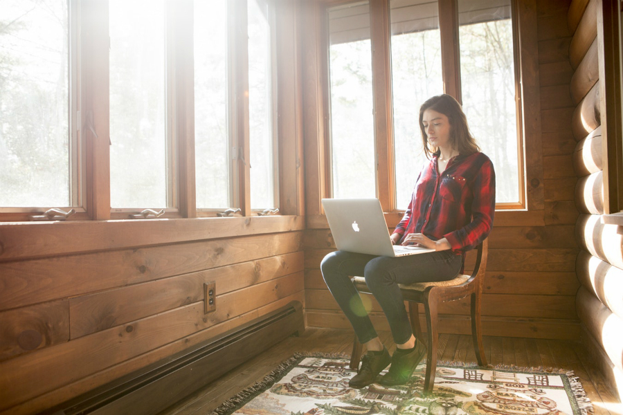 Why Standing Desks and Treadmill Desks are Essential for Remote Workers woman working from home
