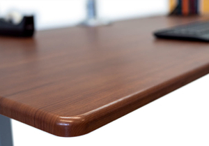 iMovR's exclusive 3D laminated desktops are always ergo-contoured and provide the look of natural hardwood without the material cost