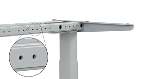 The frame of the UpLift V2-Commercial desk, showing accessory holes